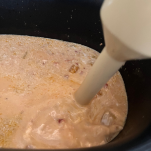 Blend the sauce to desired consistency - slow cooker coconut chicken